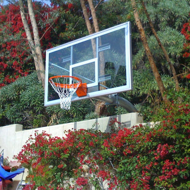 First Team Brute Supreme Fixed Height Basketball Hoop Lifestyle Image View of In Ground System Outdoors Goal Surrounded by Roses